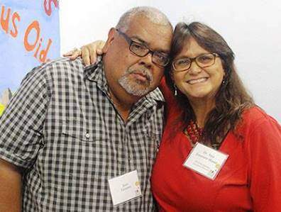 Founder Dr. Ana and instructor Jose Lozano smile for the camera