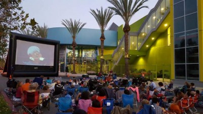 Families at an outdoor screening of The Great Mouse Detective at the Discovery Cube Orange County